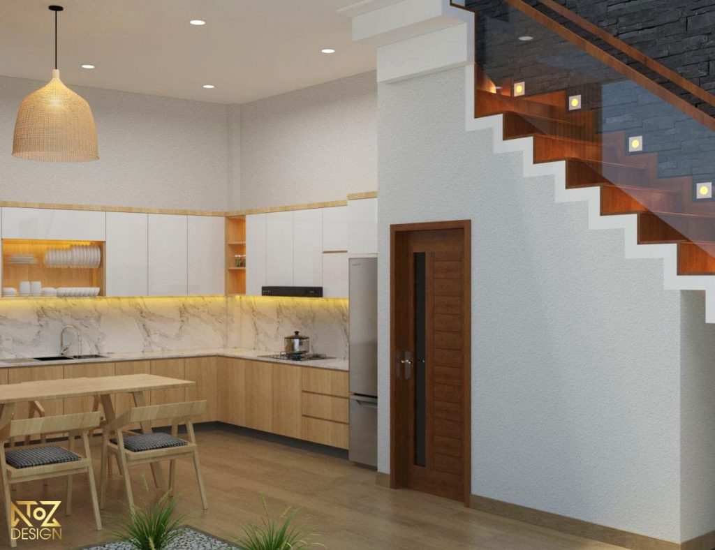 Khu vực bếp được thiết kế với tông màu vàng kết hợp tông trắng của kệ tủ